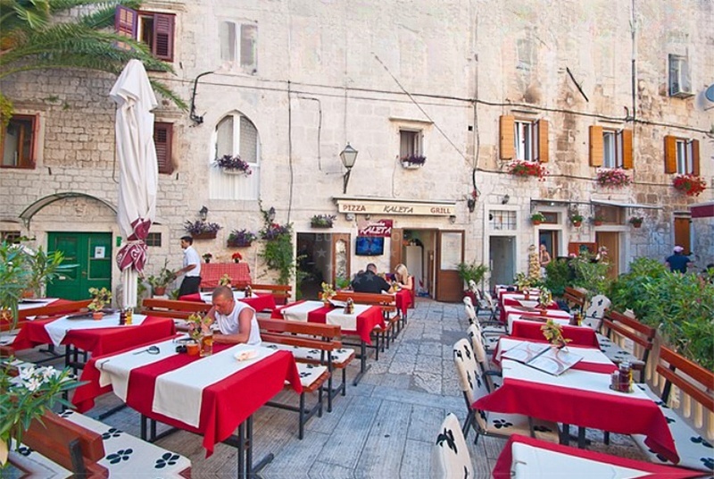 Dining area at Kaleta Restaurant overlooking Trogir Harbour