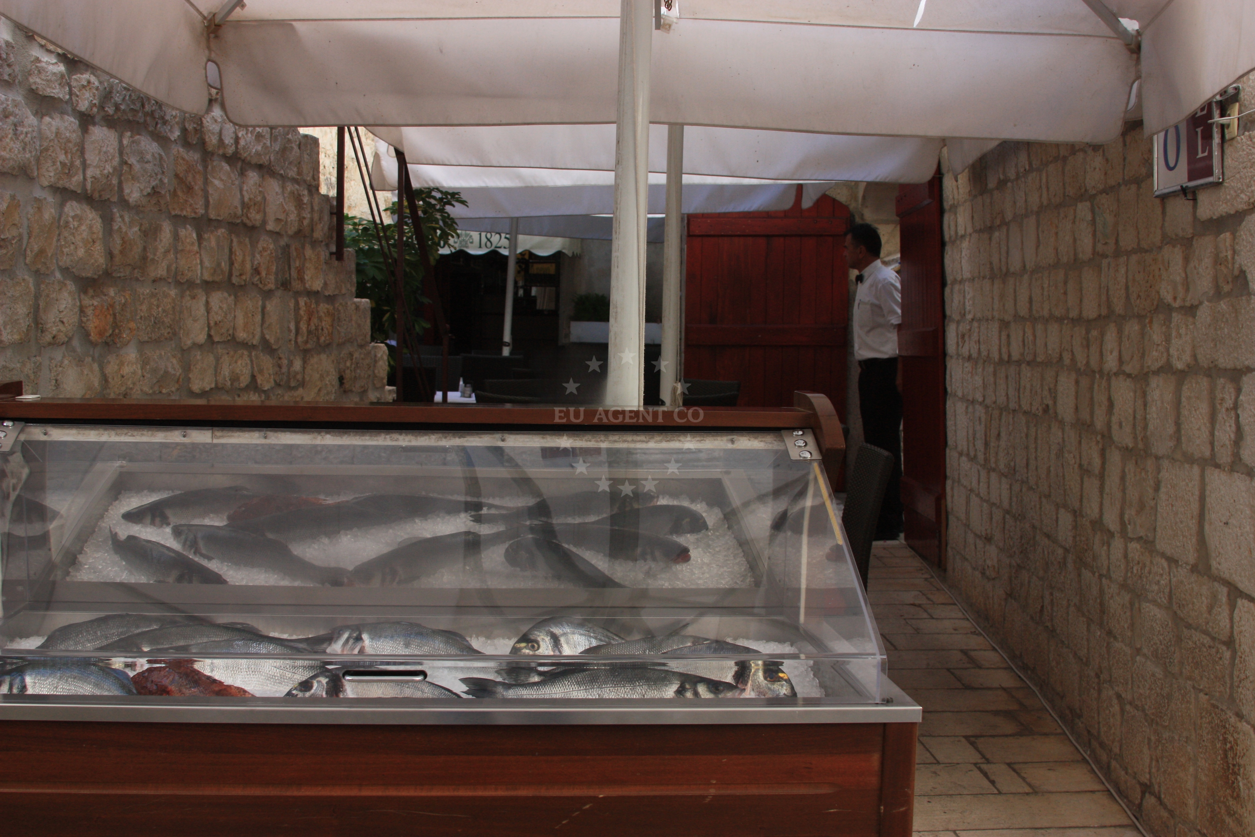 Dining area at Kamerlengo Restaurant, Trogir, with views of the historic Old Town and marina