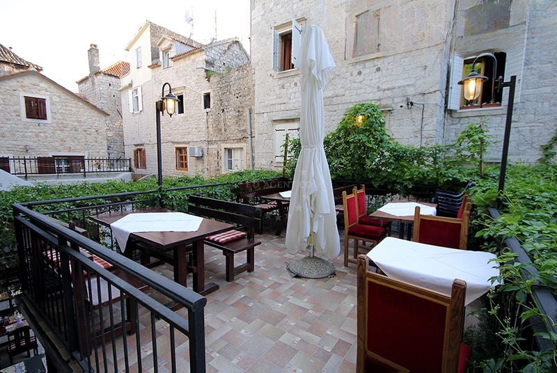 Tragos Restaurant's historic wine cellar interior with wooden ceiling and stone tiles