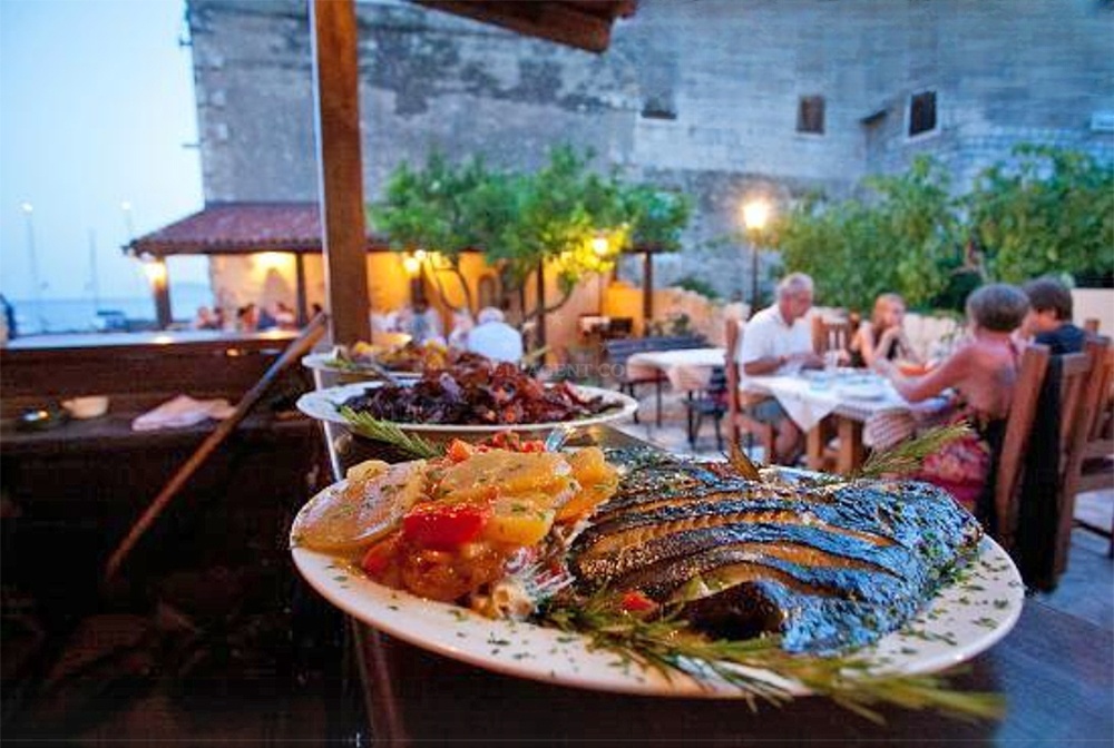 Sea view from Barba Restaurant, Komiza, Vis, with boats docked nearby