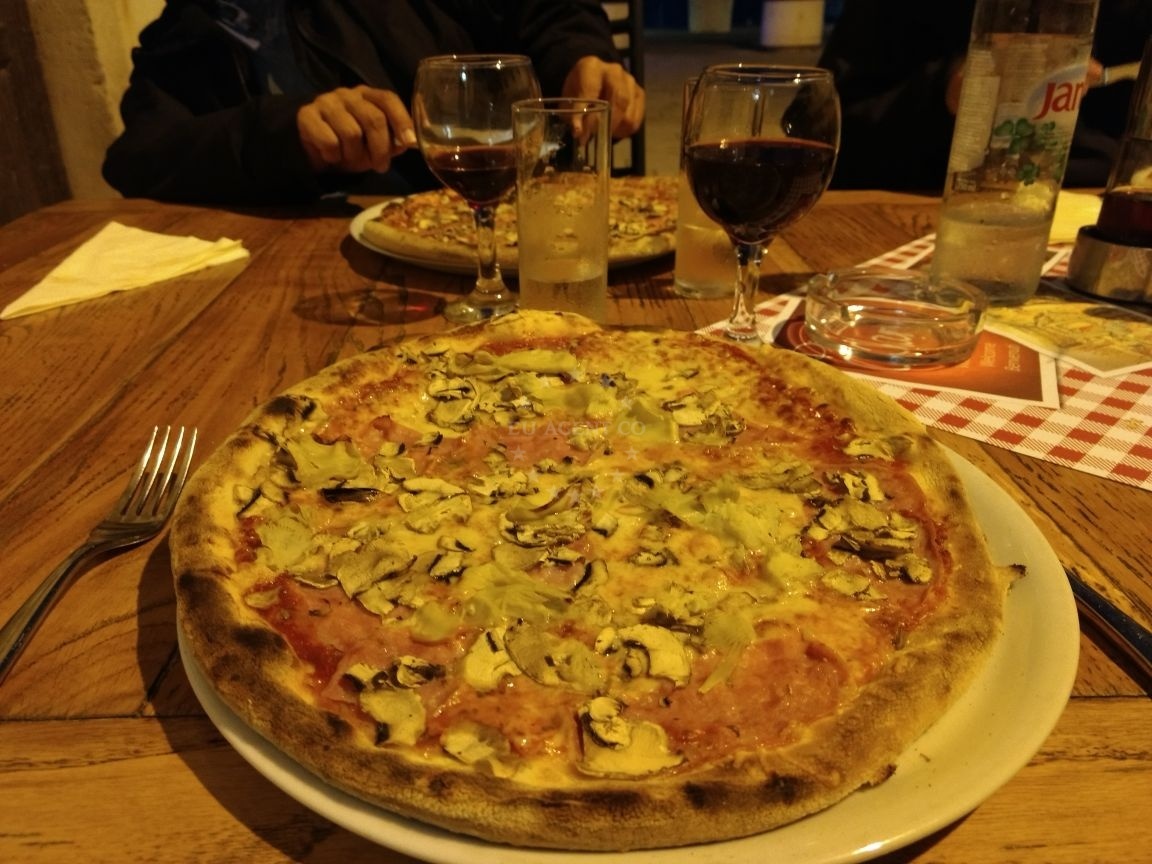 Pizzeria Charly's menu featuring local dishes