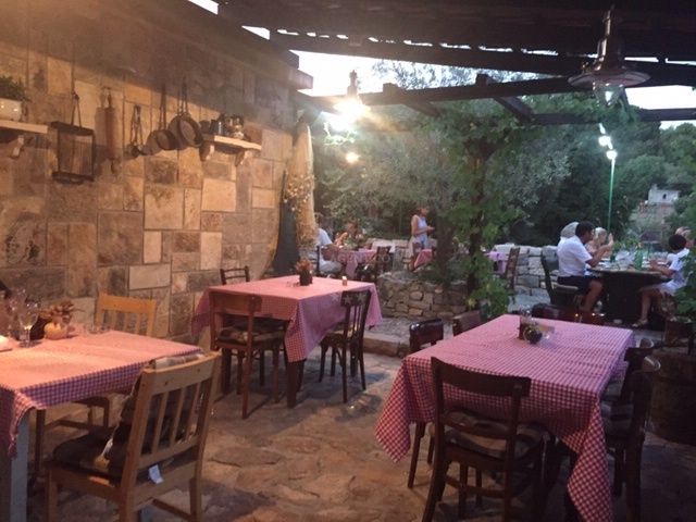Konoba Prslika restaurant in Zlarin, Croatia, with a view of the port and surrounding area