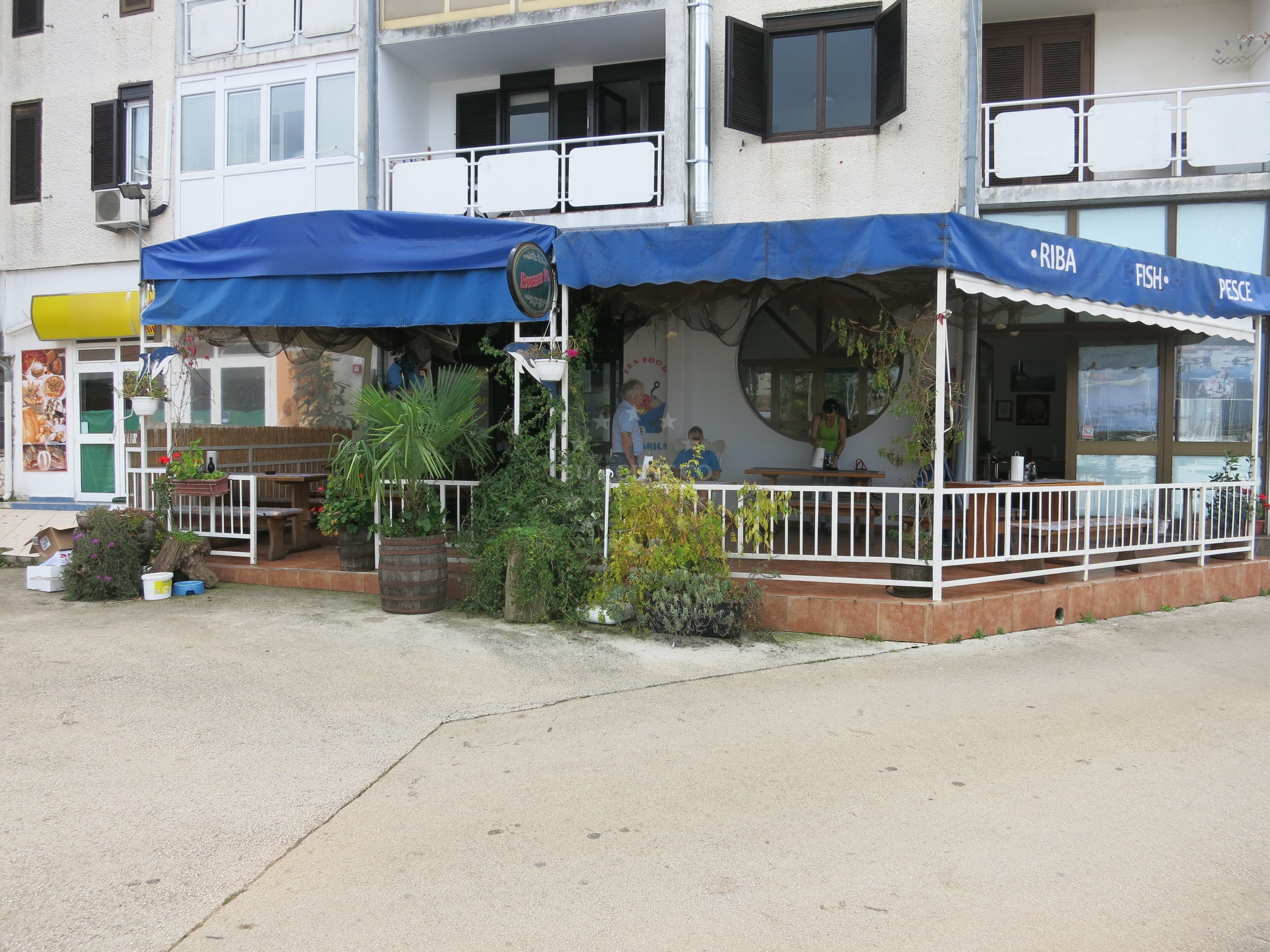 Dining area at Ribarica Restaurant with marina views