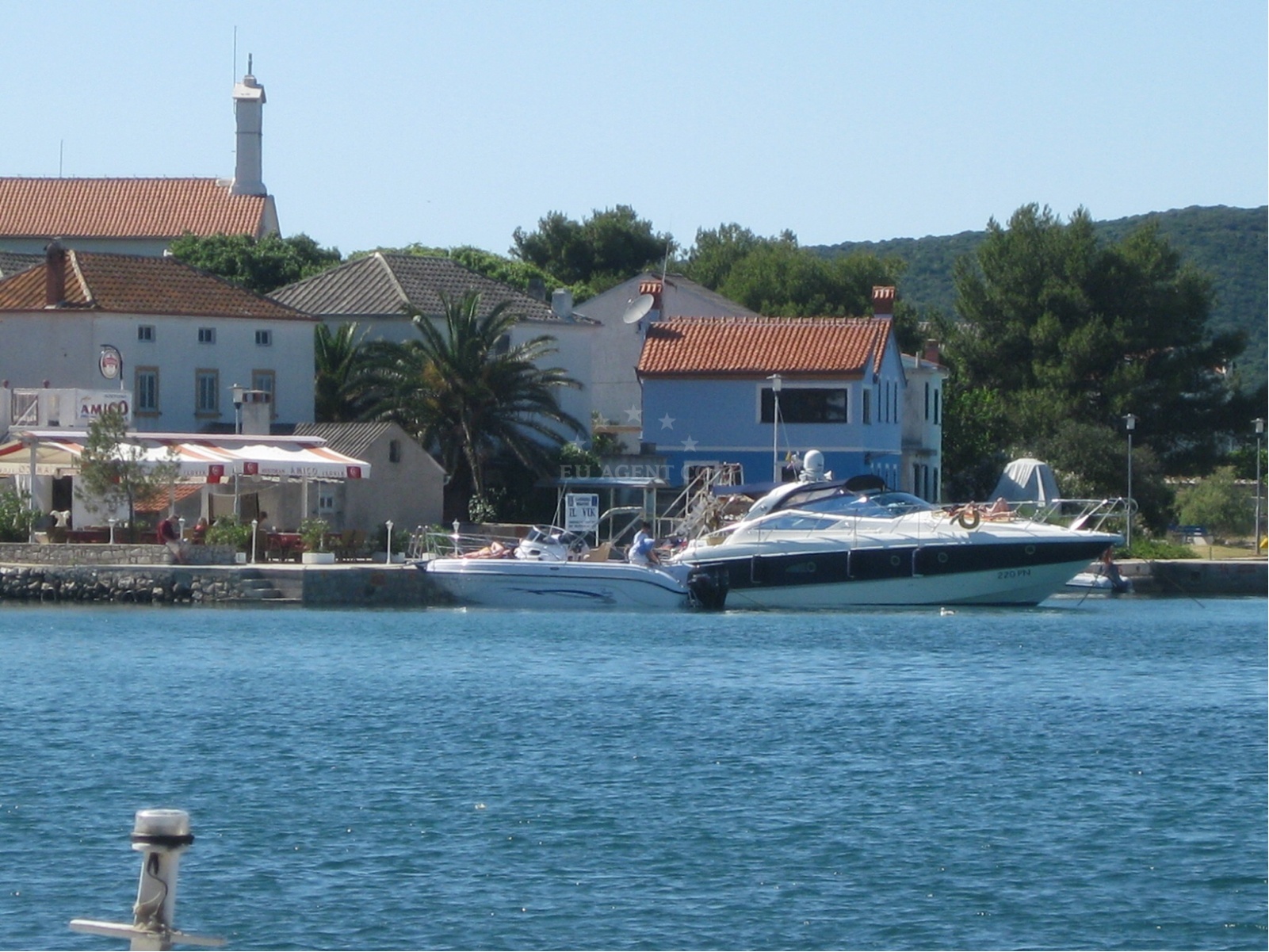 Sailboats moored near Amico Restaurant in Ilovik, Istria and Kvarner