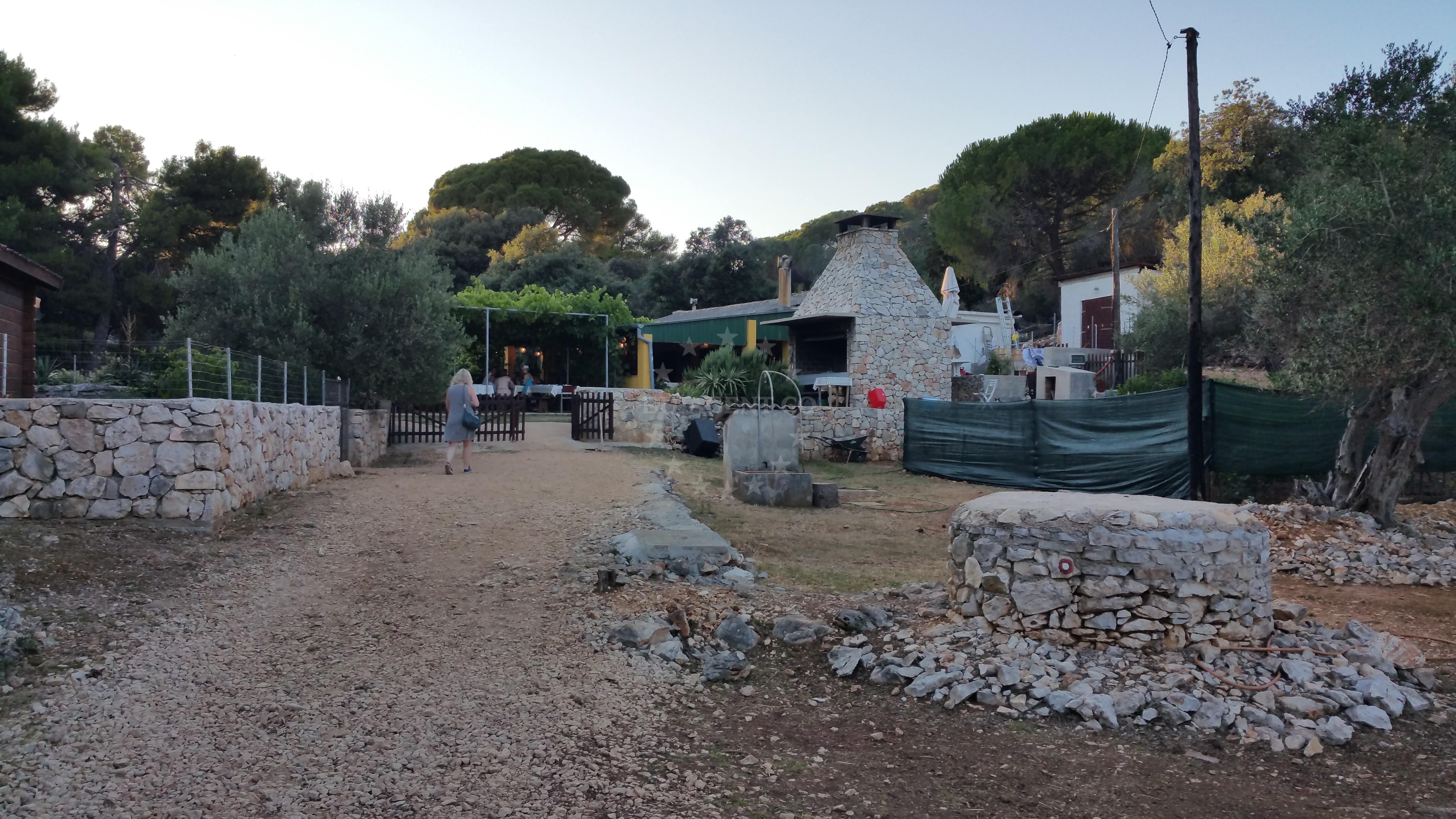 Rustic Balvanida Restaurant with outdoor grill and jetty view