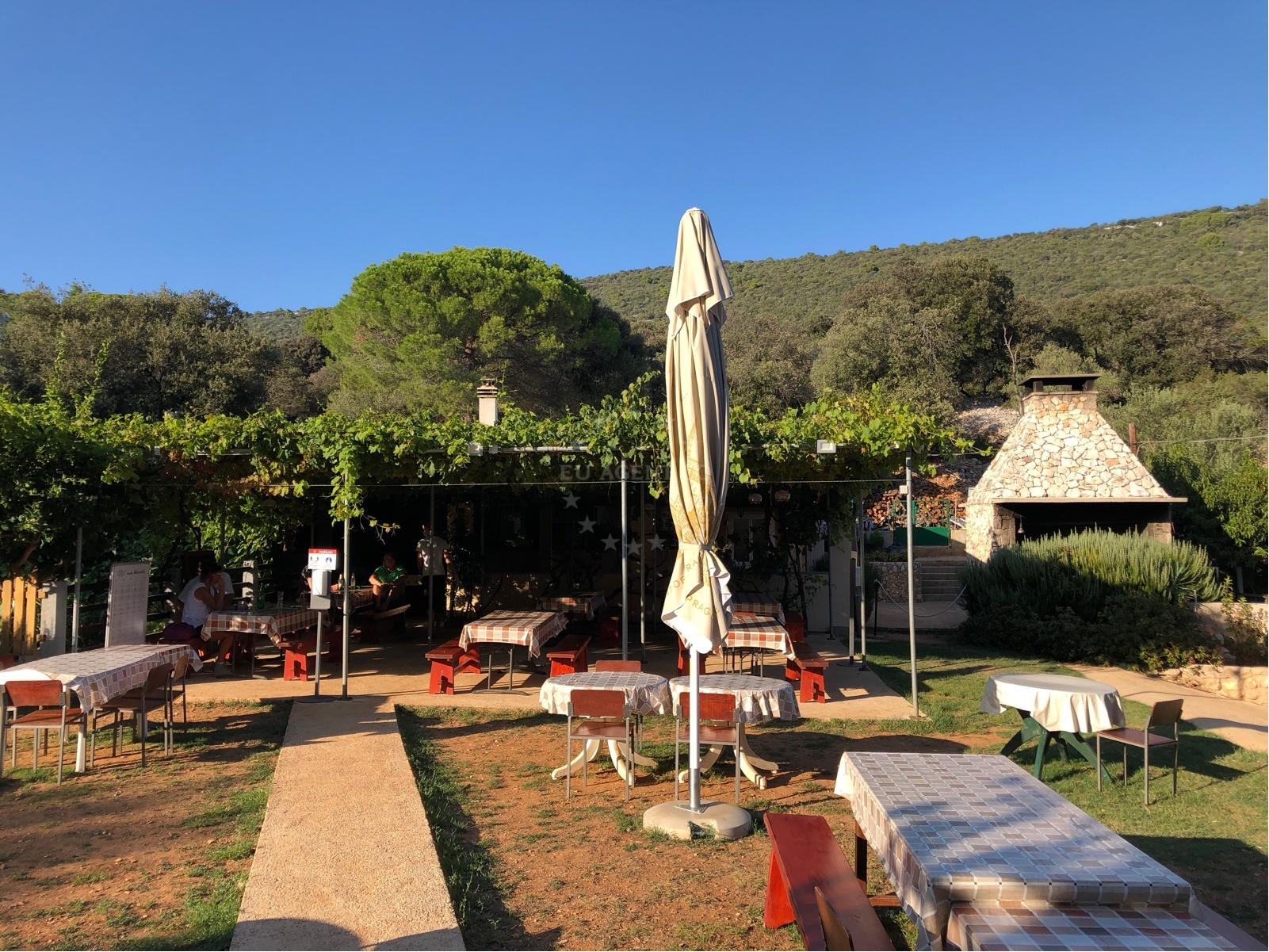 Balvanida Restaurant's rustic interior with homemade wine and brandy display