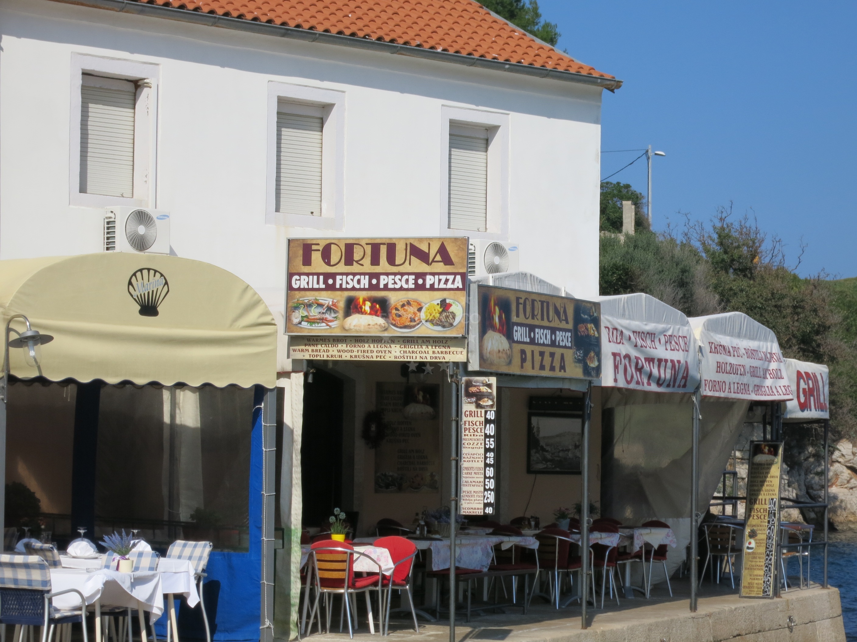 Pizzeria Fortuna in Veli Losinj, Croatia, offering fresh seafood and wood-fired pizza.