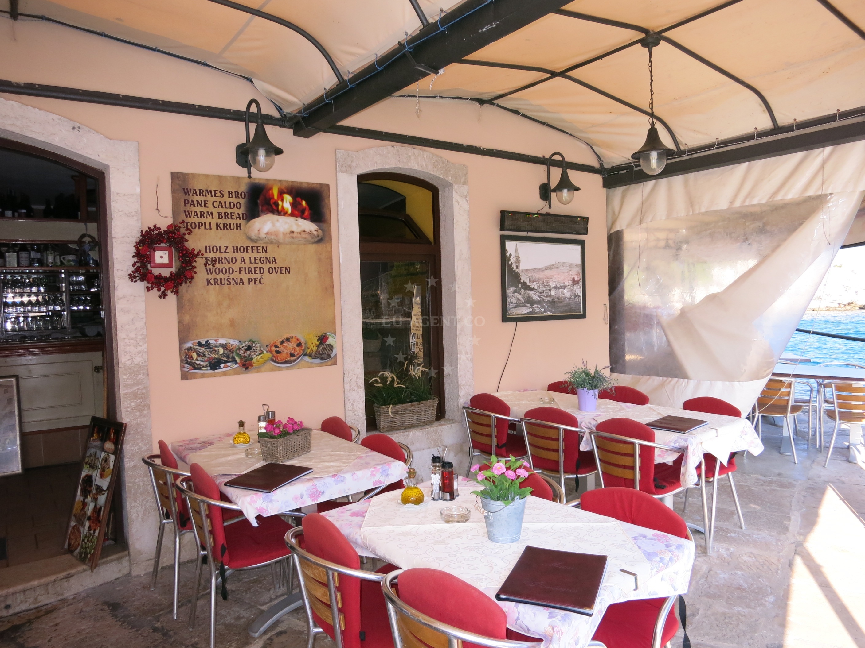 View of Veli Lošinj from Pizzeria Fortuna, with boats in the distance.