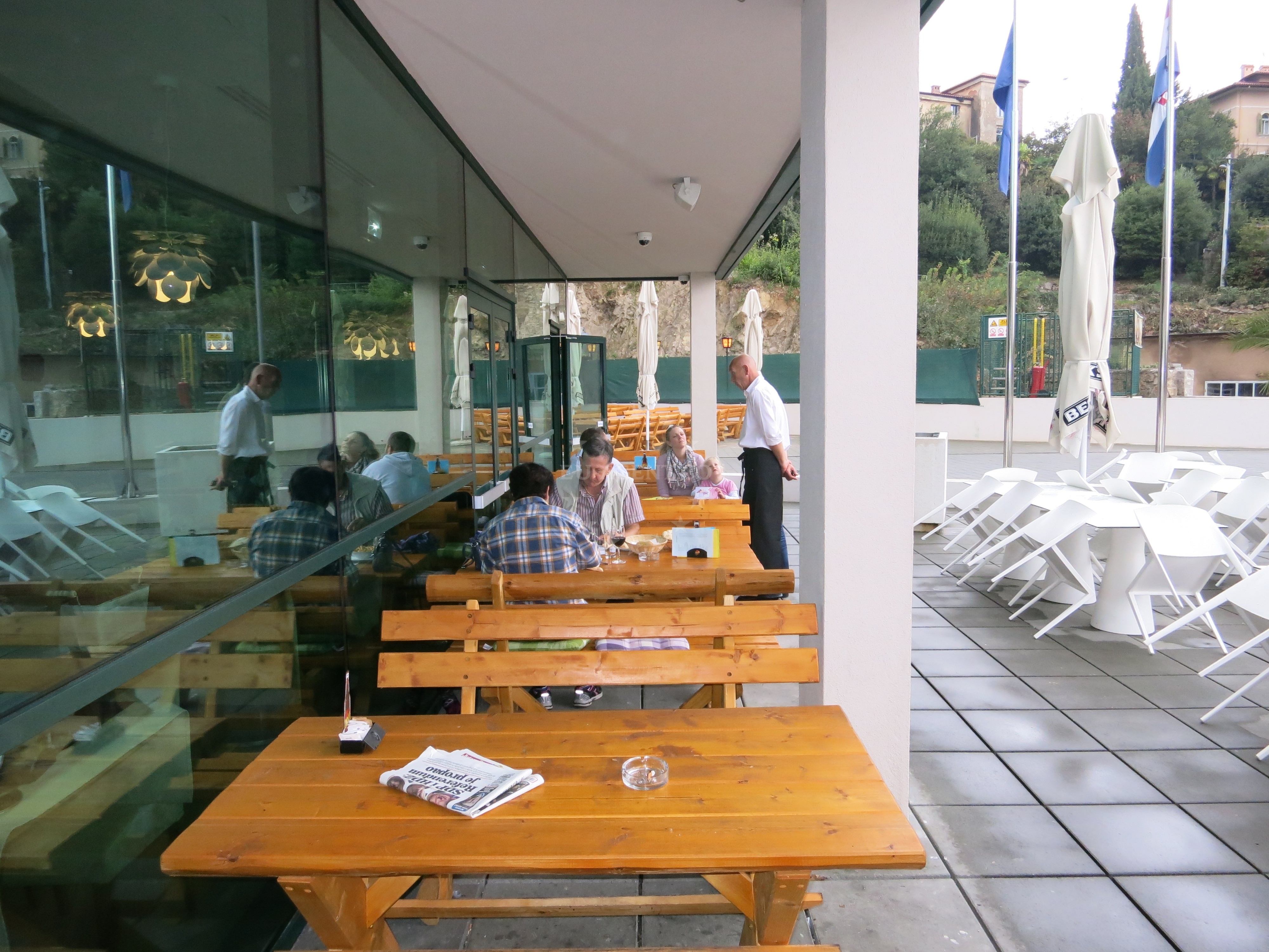 Dining area at Restaurant Volos overlooking the coast