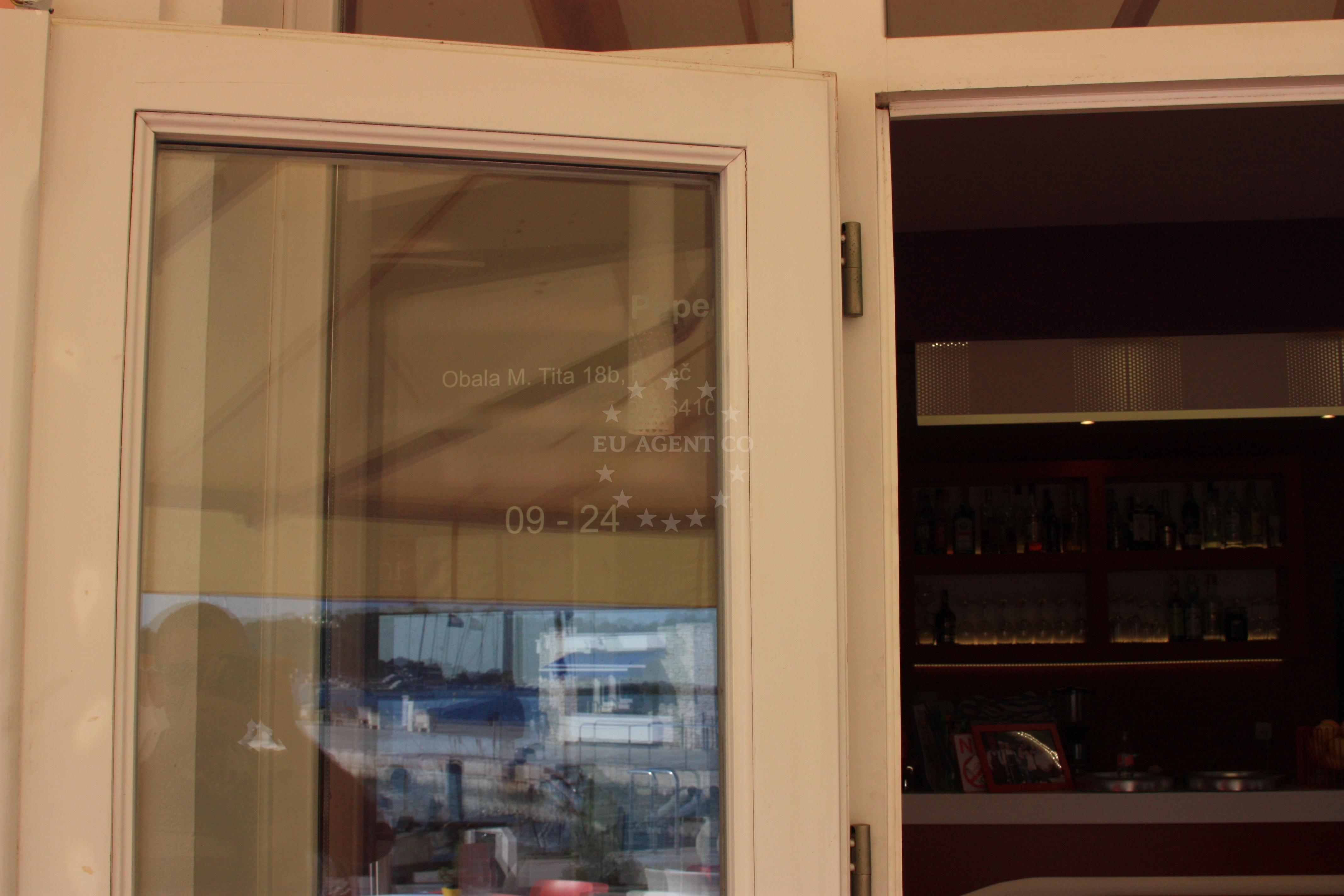 Dining area at Peperoni Restaurant, Poreč, with views of nearby marina