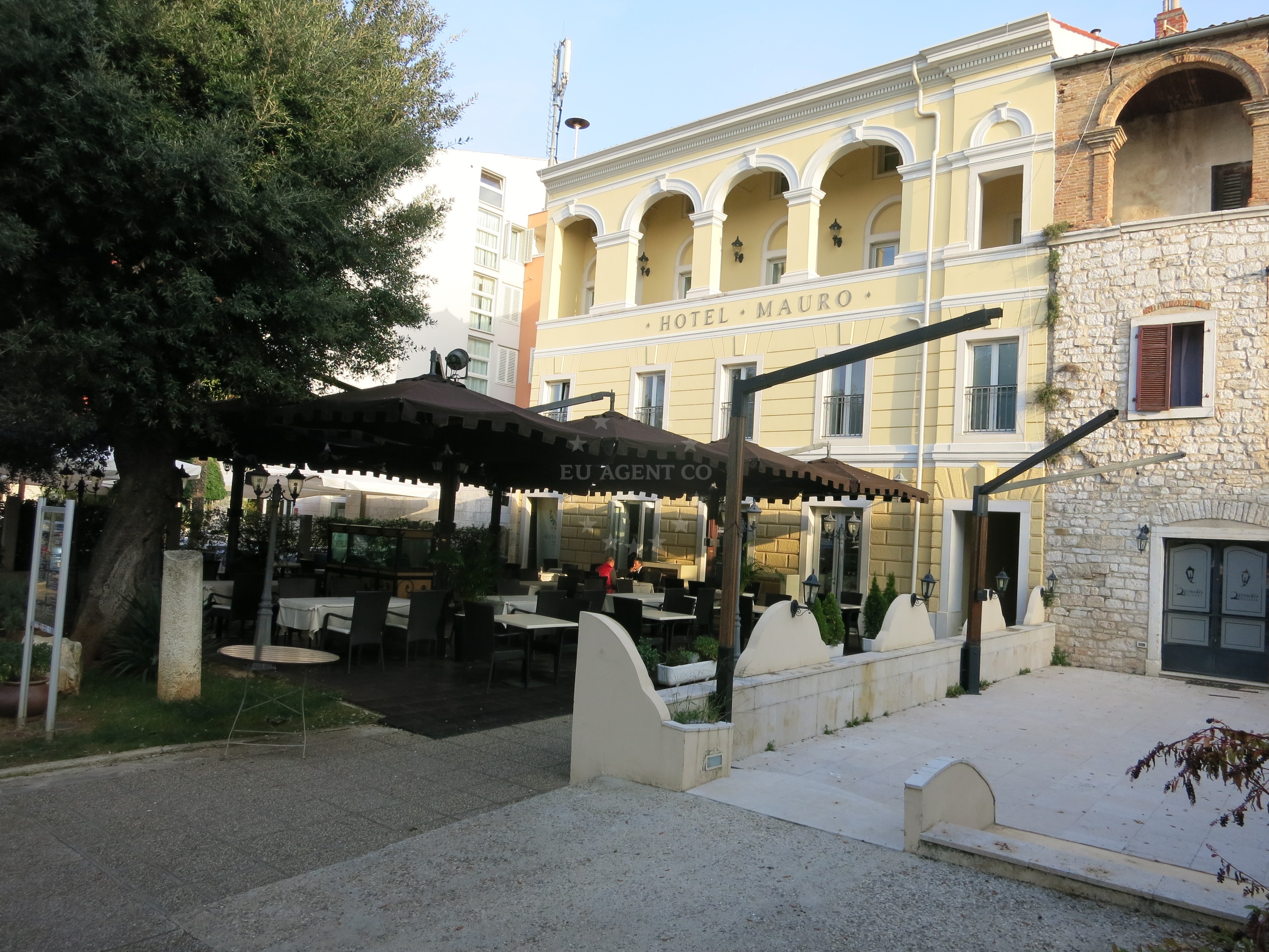 Dining area at Restaurant Mauro, Poreč, with views of Harbour Poreč