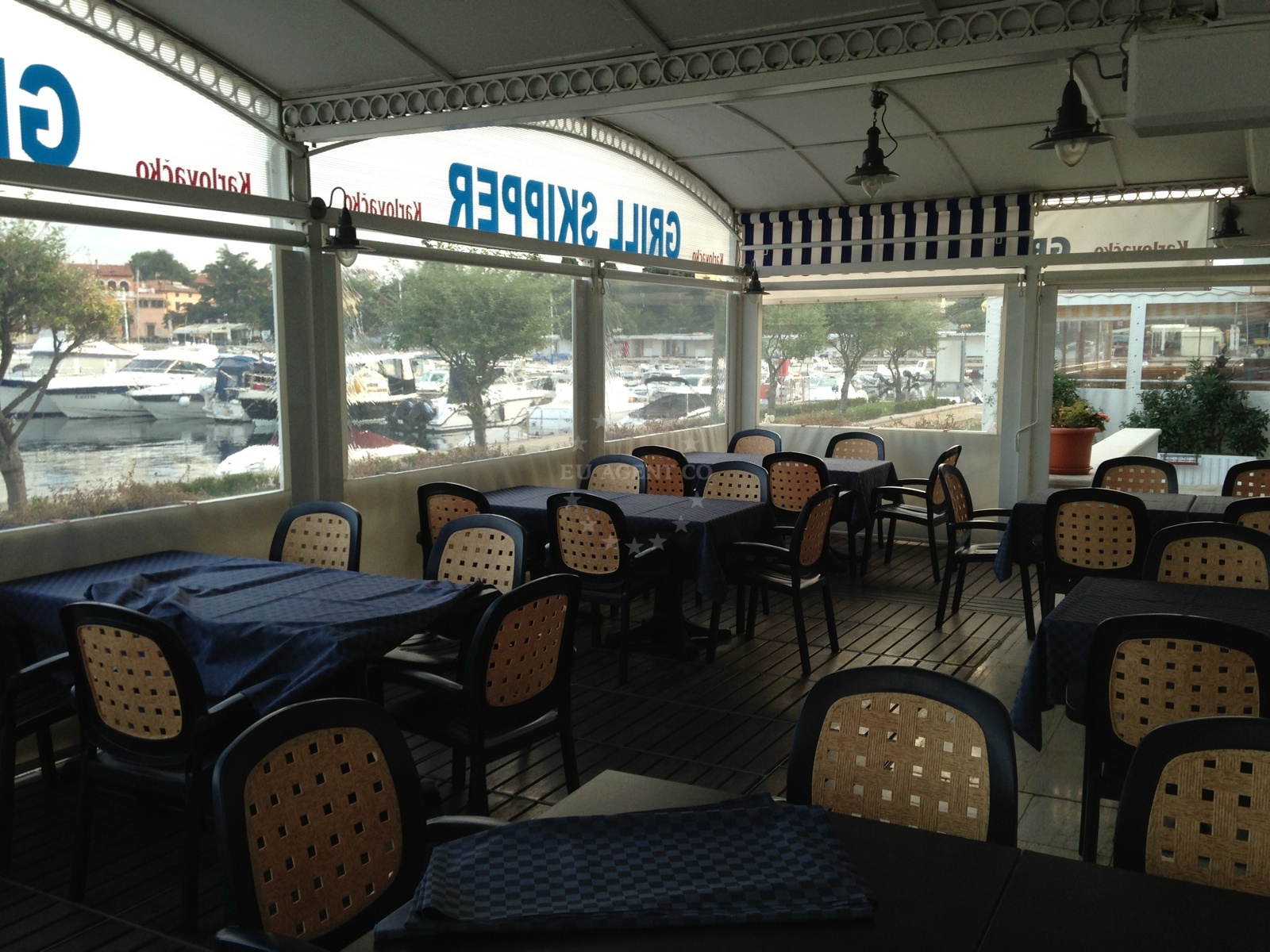 Dining area overlooking the sea with grilled seafood on display
