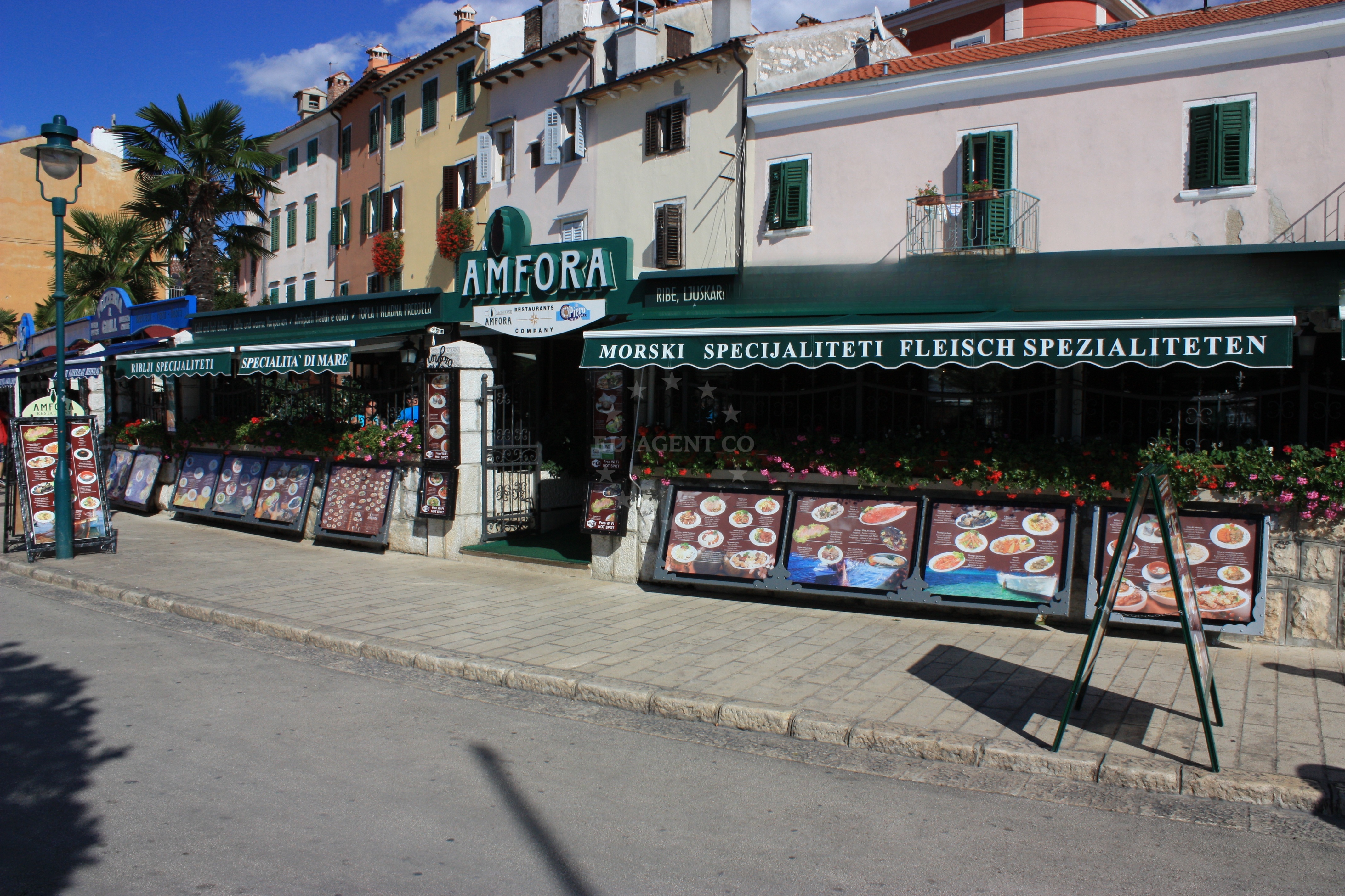Amfora Restaurant in Rovinj, overlooking the Adriatic Sea with views of the marina.