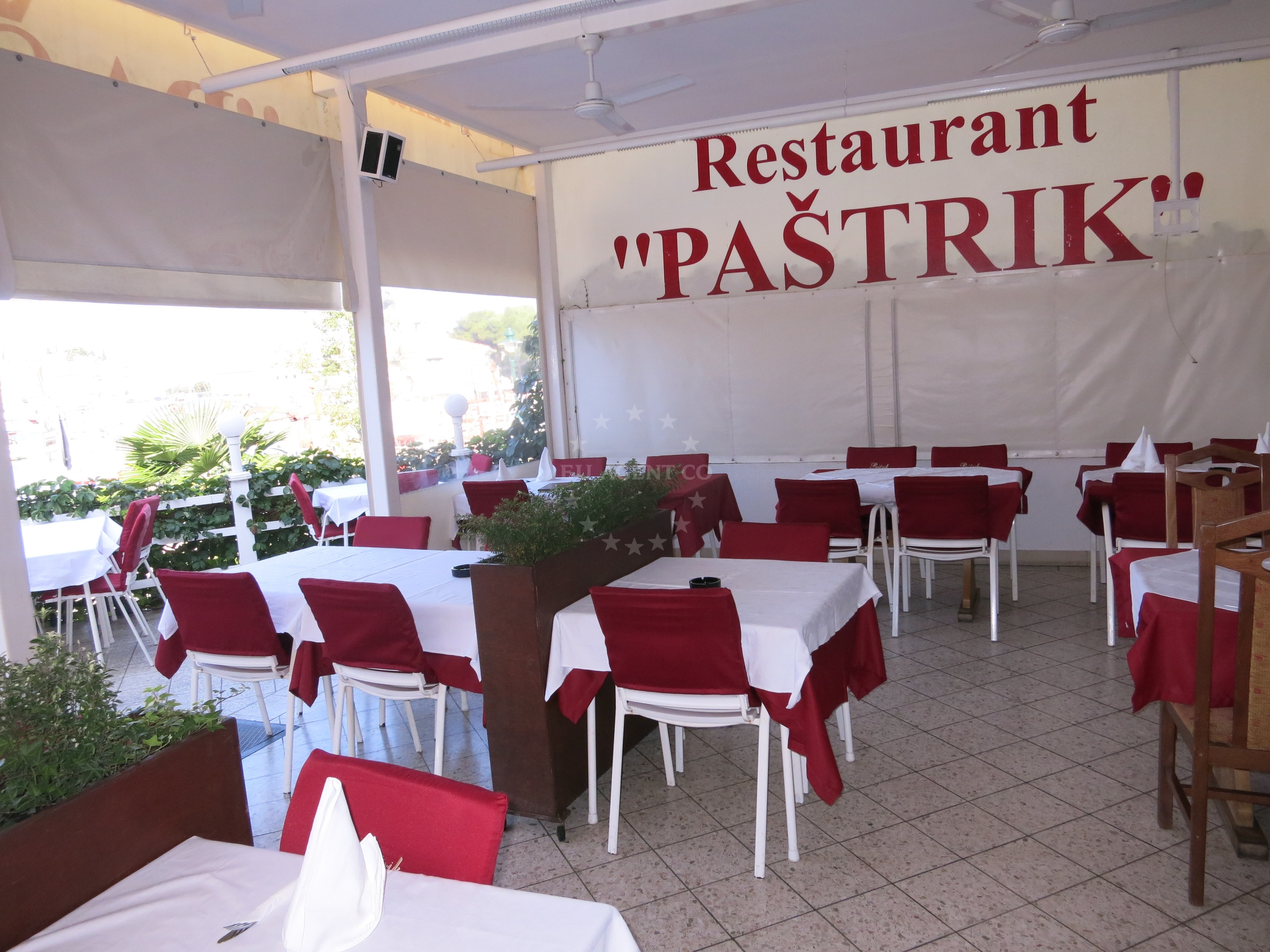 Restaurant terrace with sunset over Rovinj