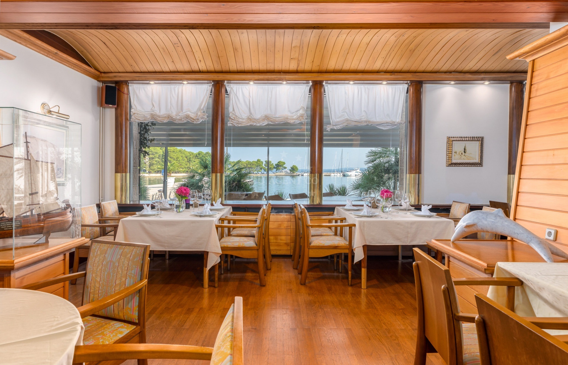 Restaurant Galija on Veli Brijun Island, overlooking the Adriatic Sea with nearby Marina Brijuni in the distance