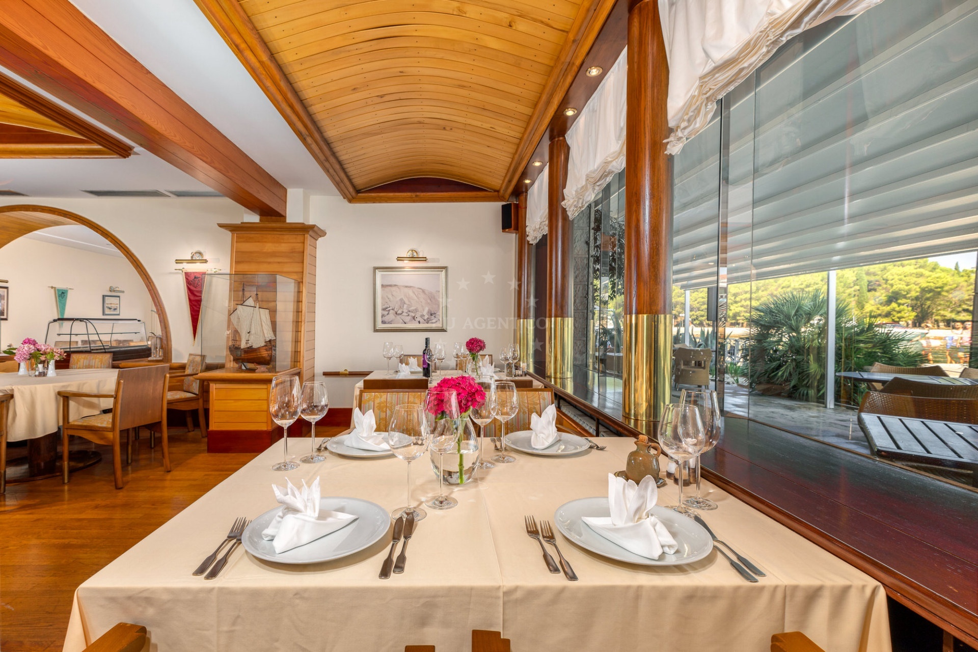 Dining area at Restaurant Galija, featuring traditional Croatian decor and views of the Brijuni Islands