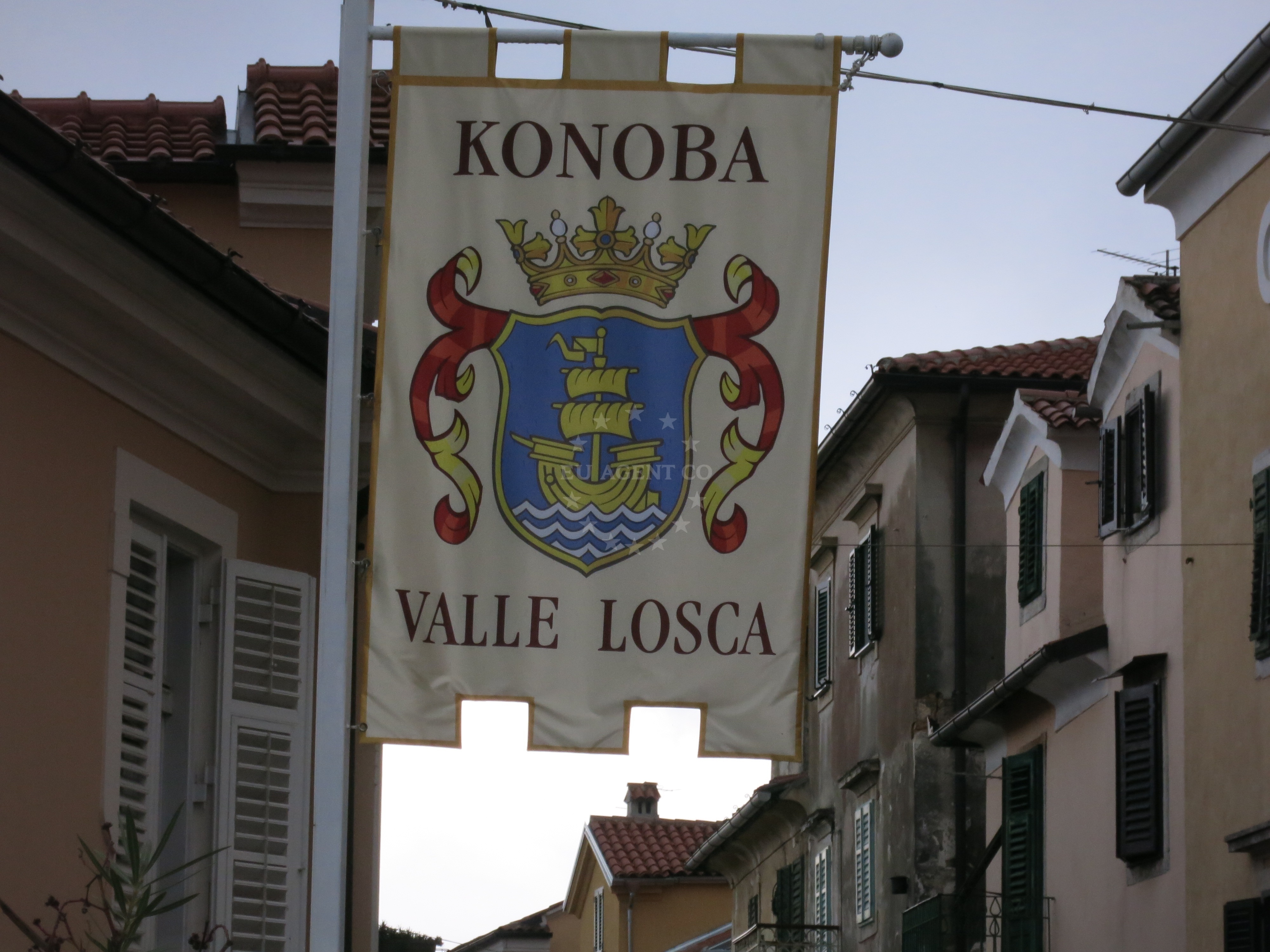 View from Valle Losca Restaurant toward the harbor of Volosko with boats moored along the shore