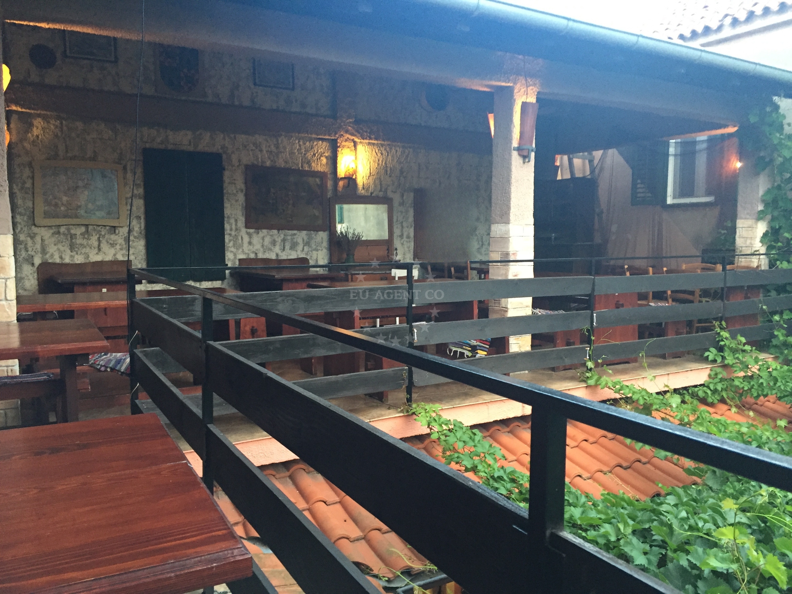 Outdoor seating at Konoba Dellicia overlooking the Adriatic