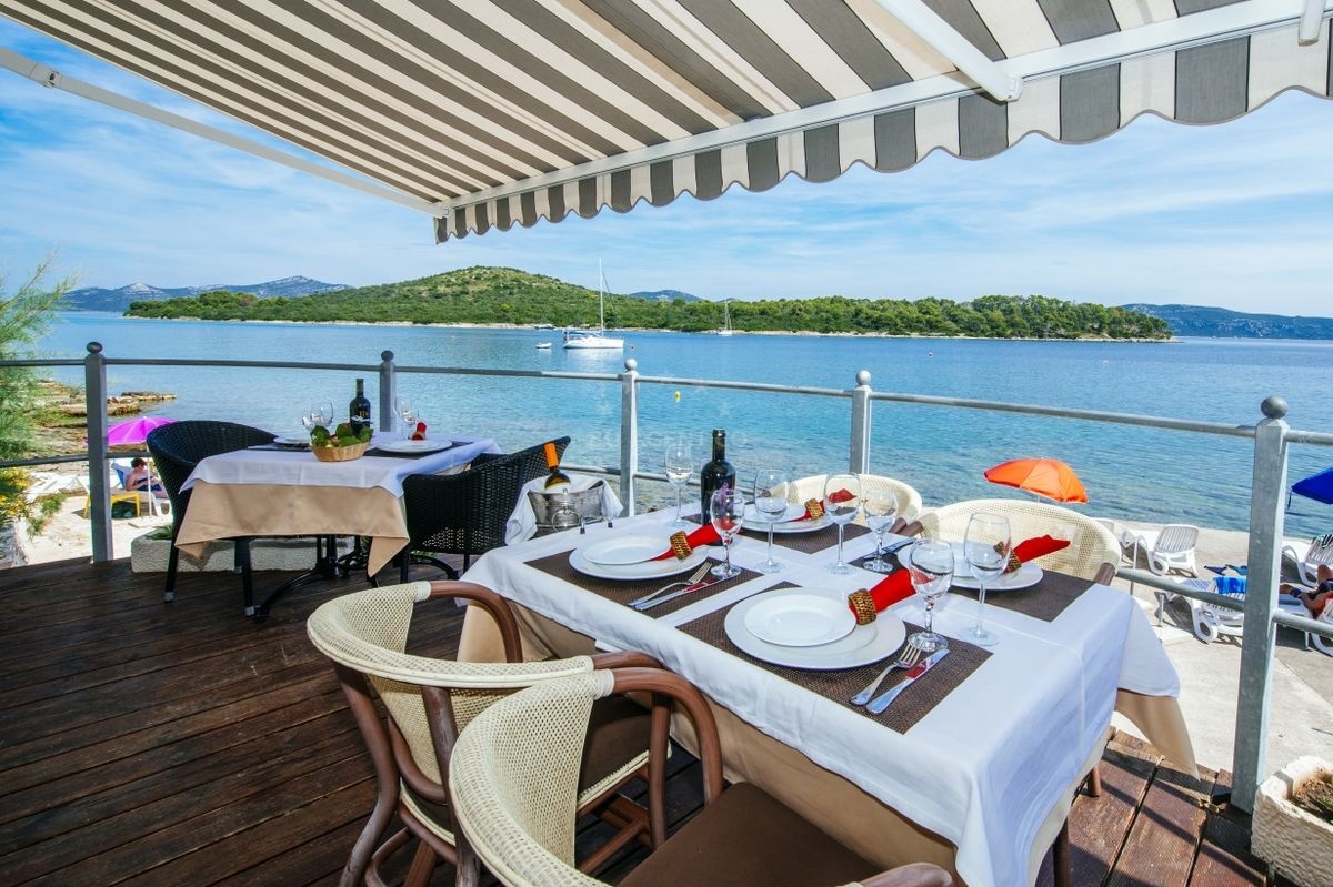 Baroni Restaurant terrace overlooking the bay on Iz Island, North Dalmatia
