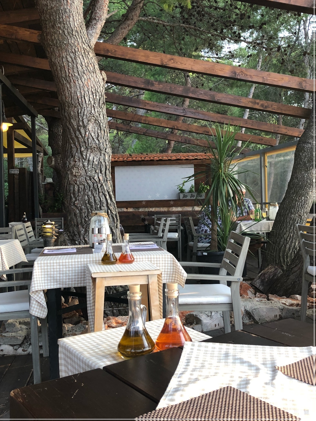 Beach longe at Liberty Restaurant with sunset over Kaprije