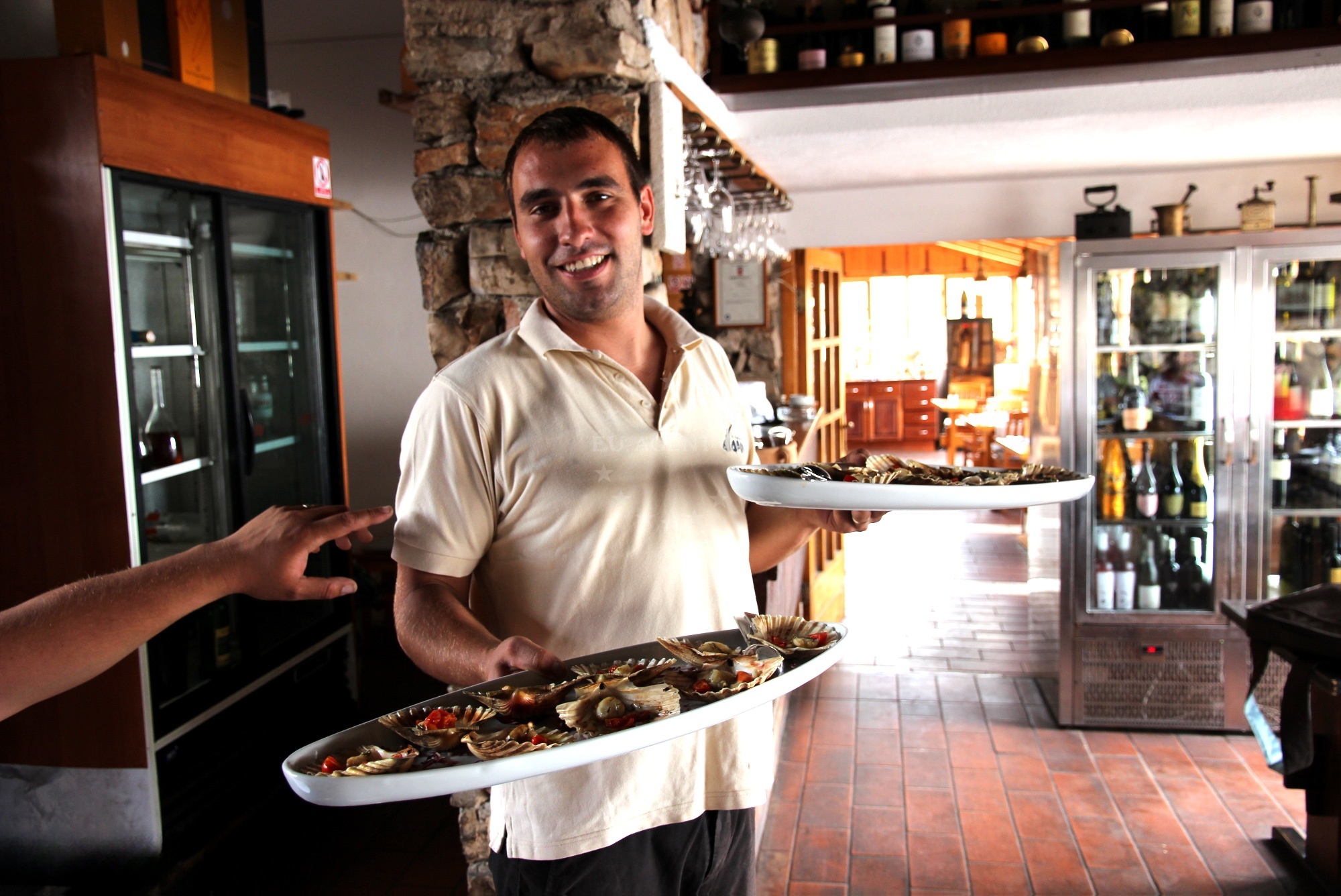 Dining area at Restaurant Opat, Kornat, with seafood platters and nautical views