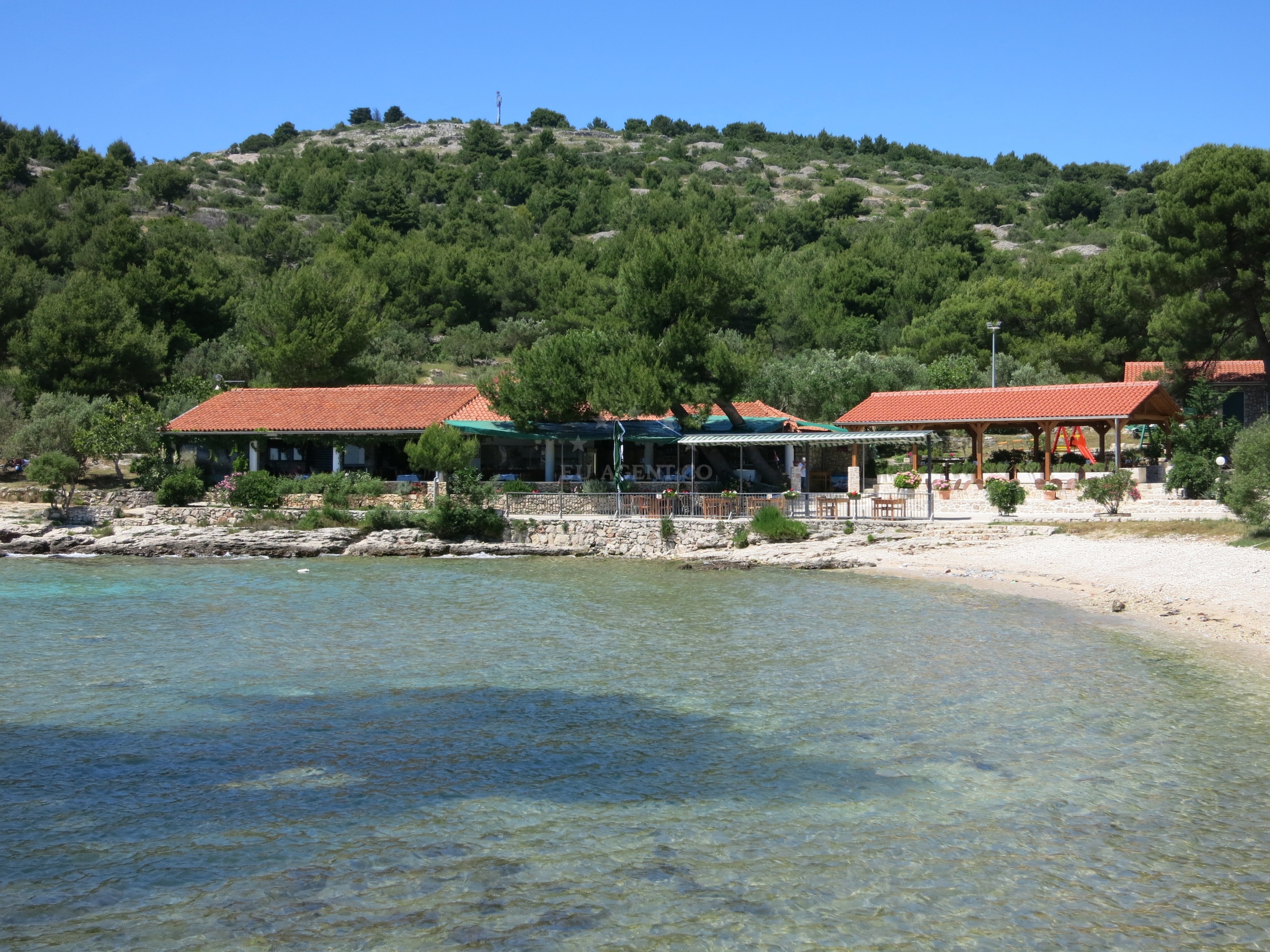 Cigrada Restaurant with nautical mooring buoys in the bay
