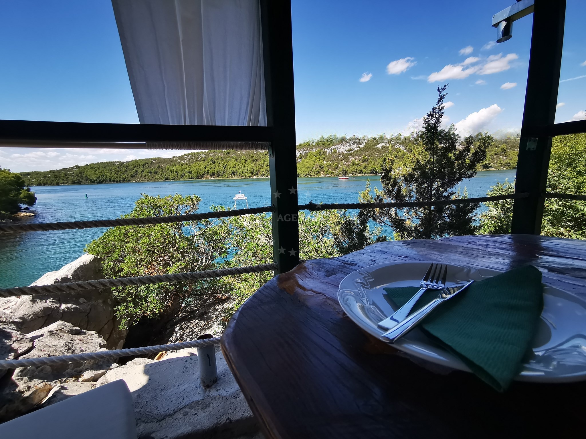 Konoba Smokvić terrace overlooking the Krka River, Skradin, Croatia