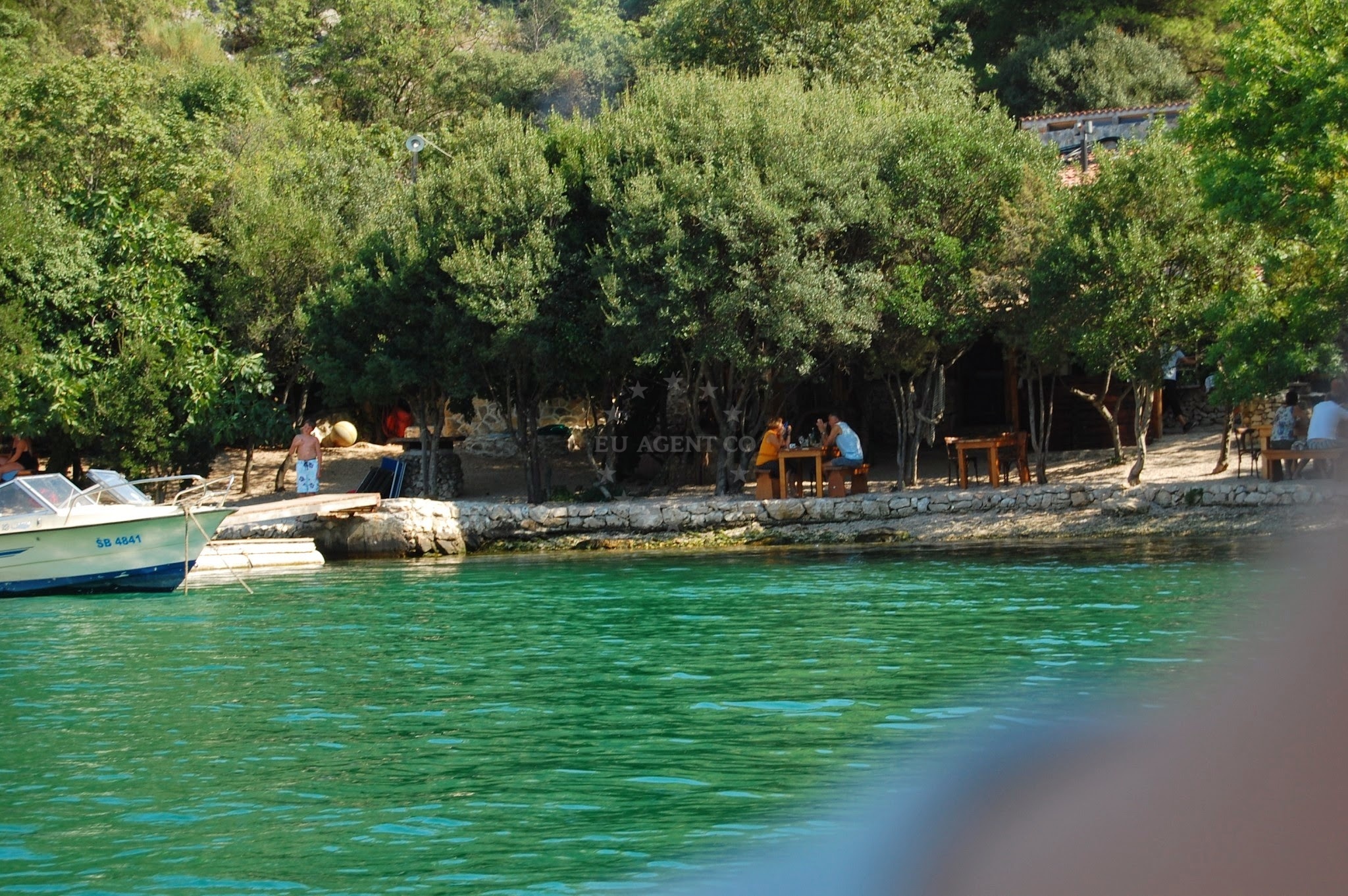 Jetty at Konoba Vidrovaca with moored yachts in Skradin
