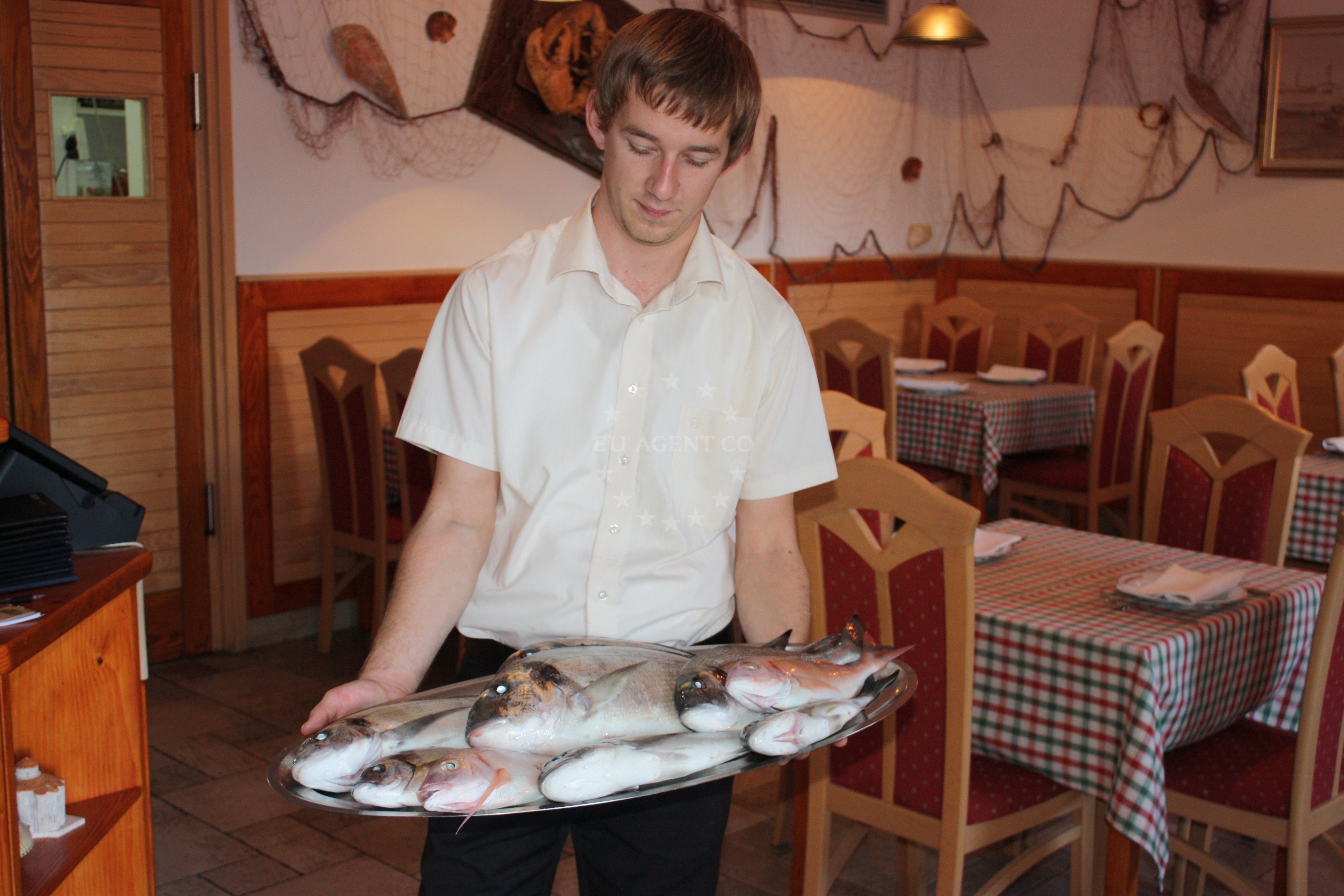 Interior of Taverna Joso with rustic decor and sea views