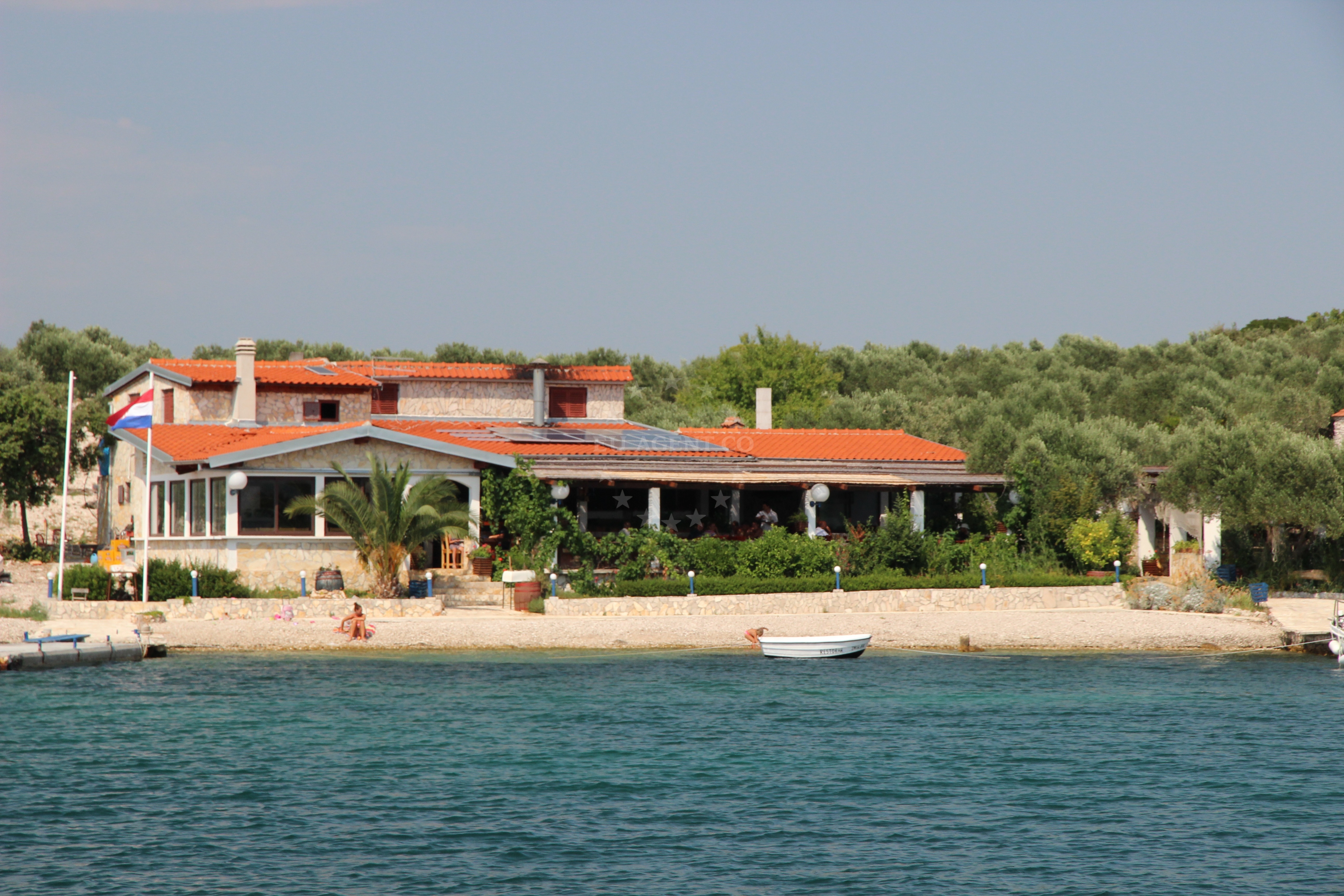 Restaurant Zminjak's jetty with yachts moored in the background, North Dalmatia, Croatia