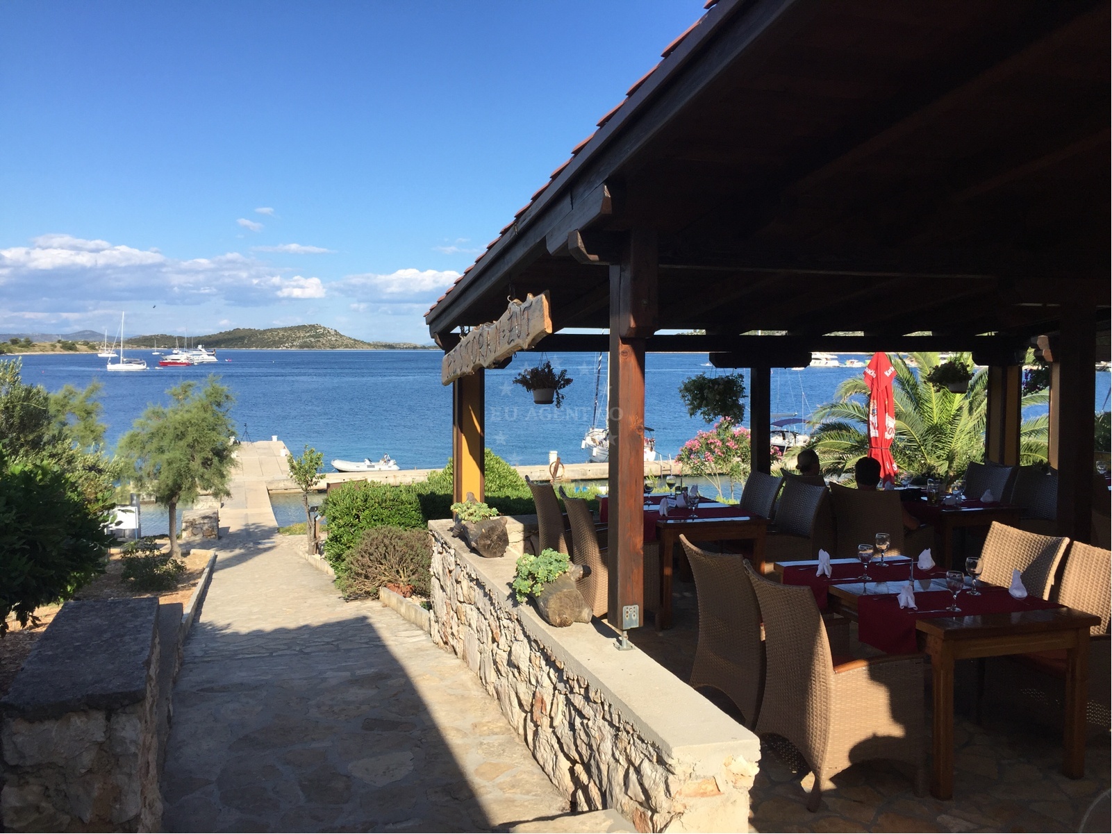 Outdoor seating at ACI Marina Zut Restaurant near the buoy field