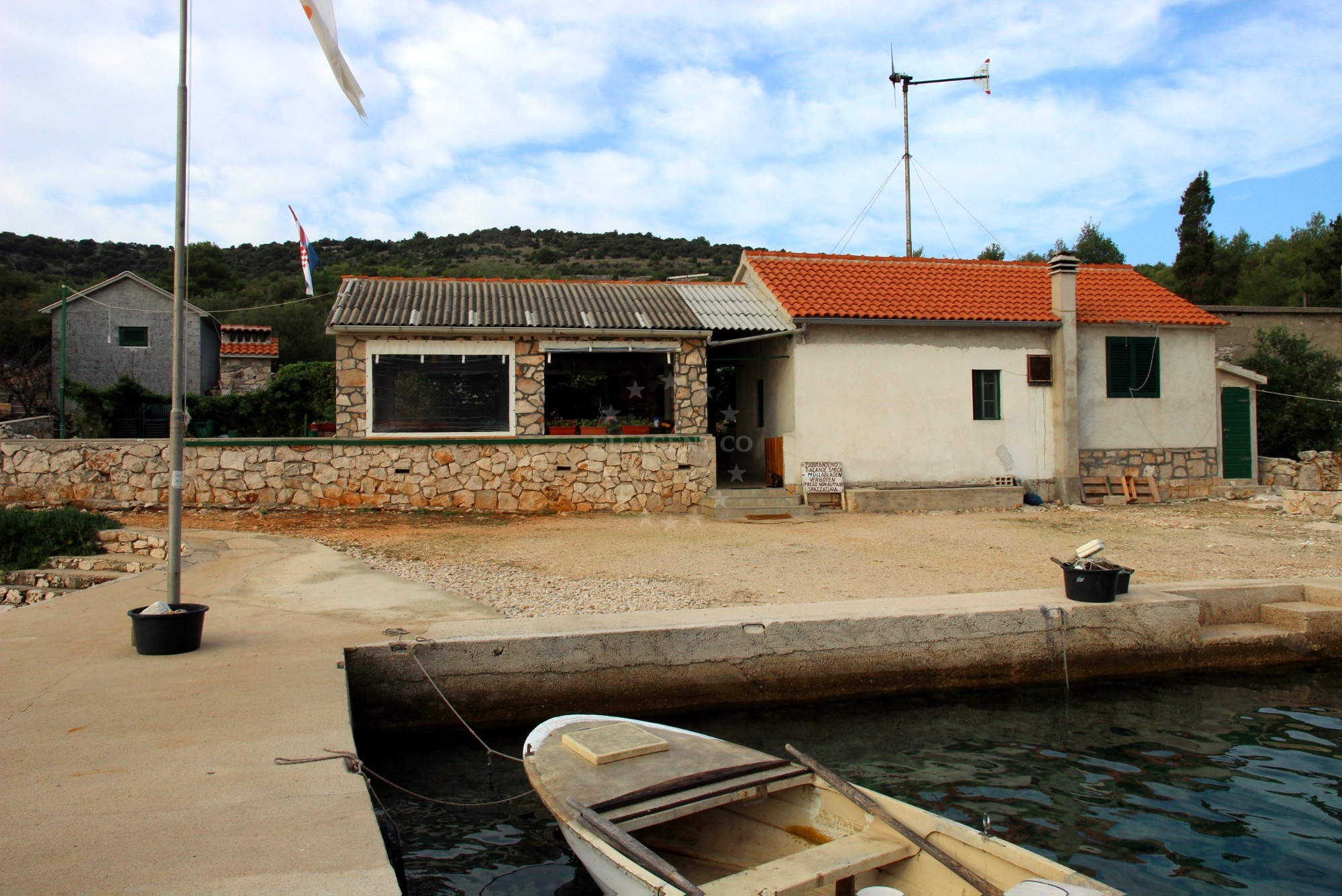 Vison Restaurant in Dragisina, Zut, North Dalmatia, Croatia with a small jetty overlooking the Adriatic Sea