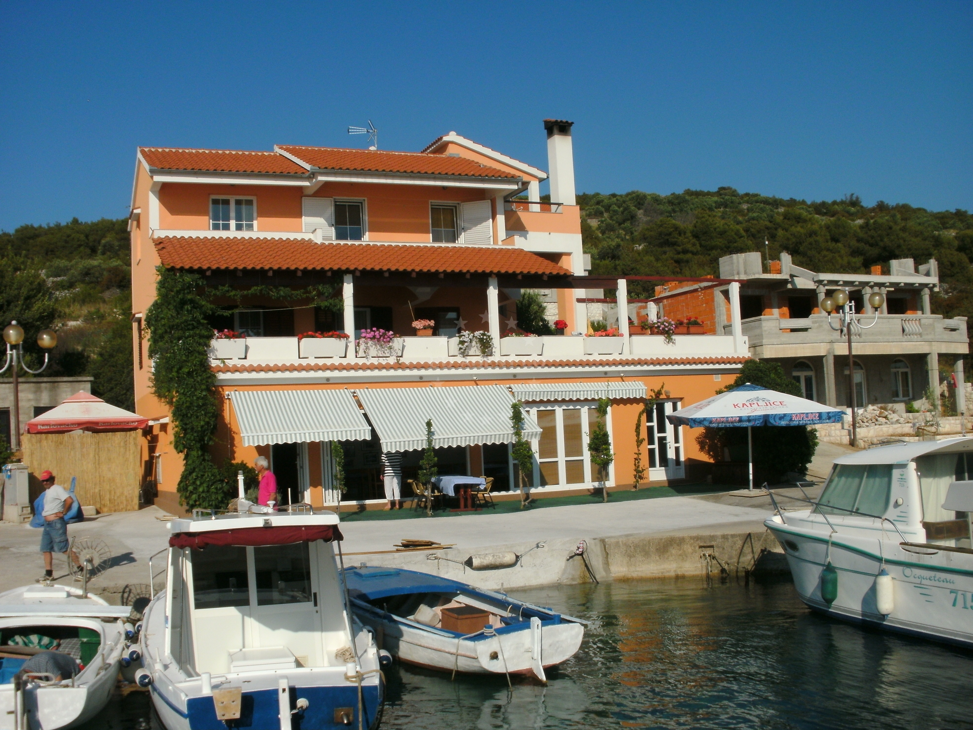 Dining area at Ristorante Zverinac, showcasing fresh seafood and risotto