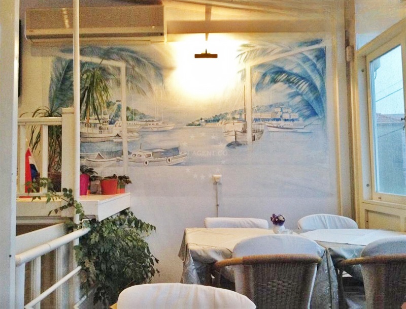 Dining area at Konoba Bata with panoramic views of the Adriatic Sea