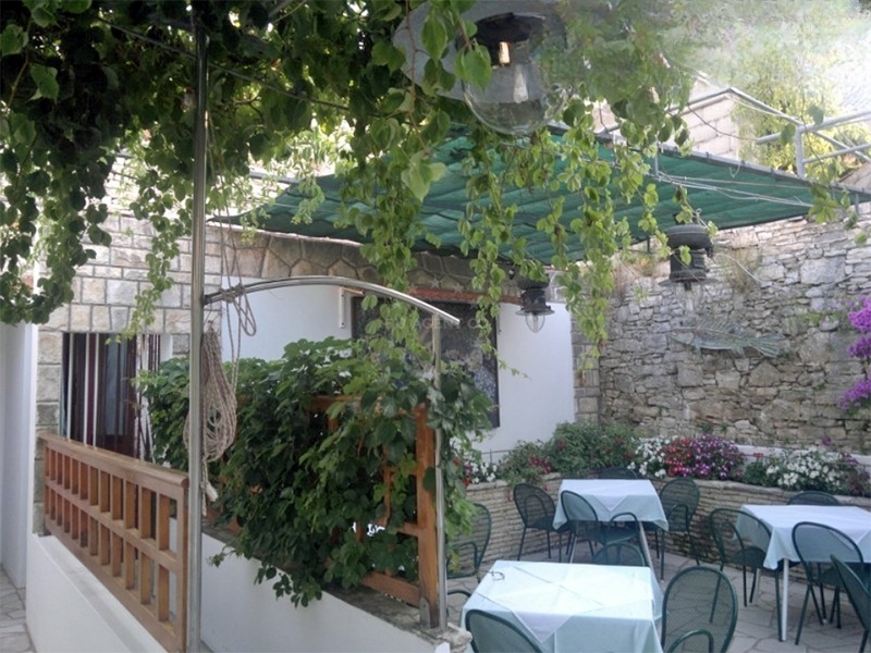 Outdoor dining area at Konoba Lucica with views of the Adriatic Sea.