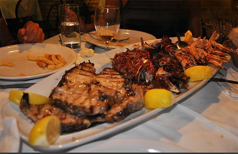 Chef grilling seafood at Konoba Lucica in Vela Luka, Korcula.
