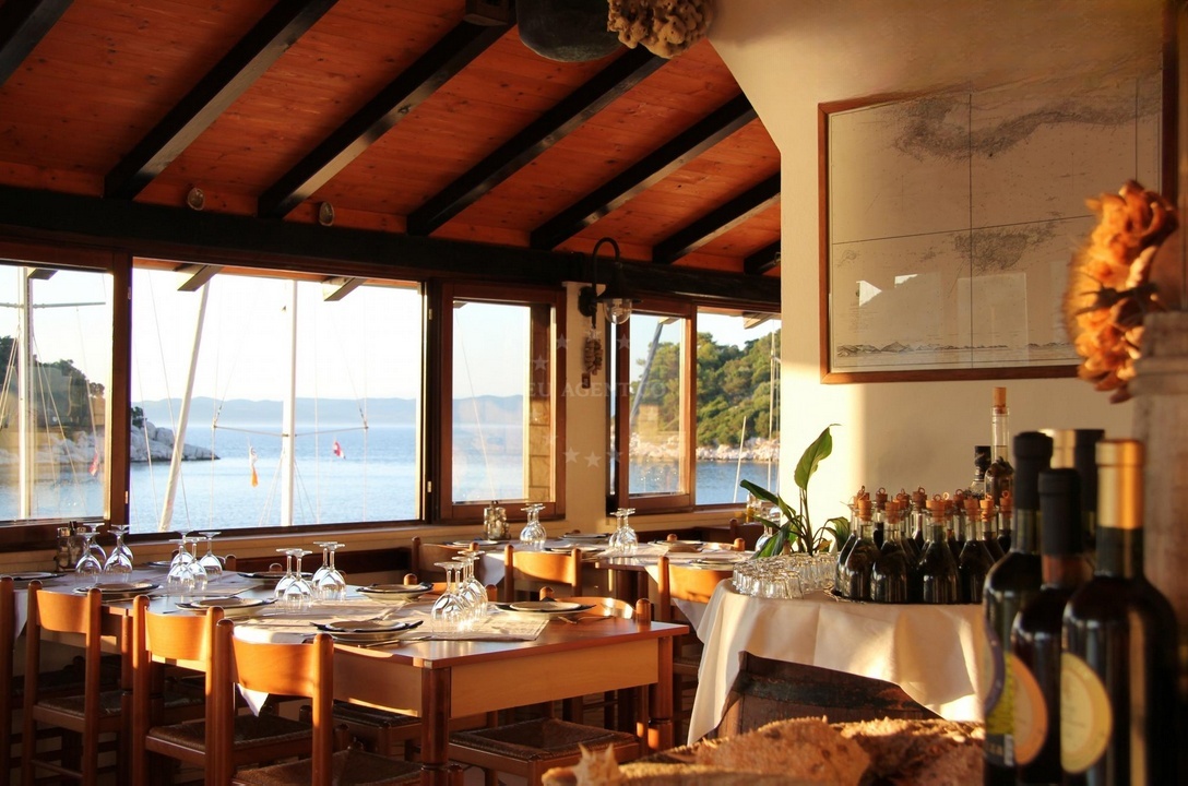 Dining area at Triton Restaurant with fresh fish on display