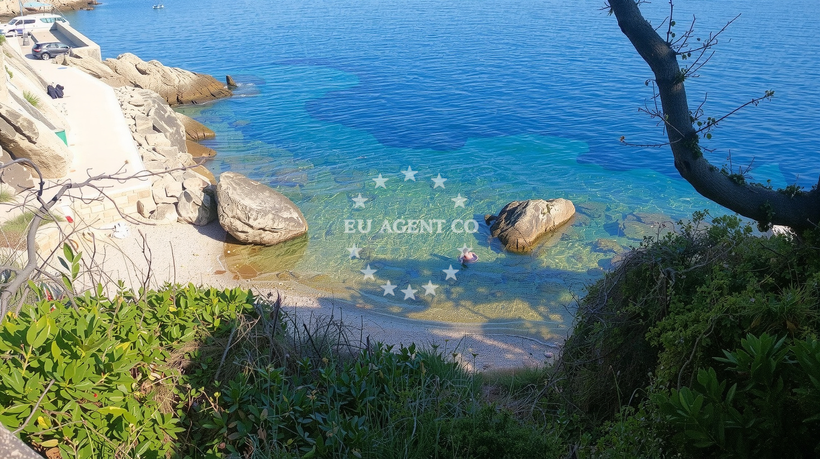Beach near Kozarica, Mljet, with clear waters and nearby restaurant
