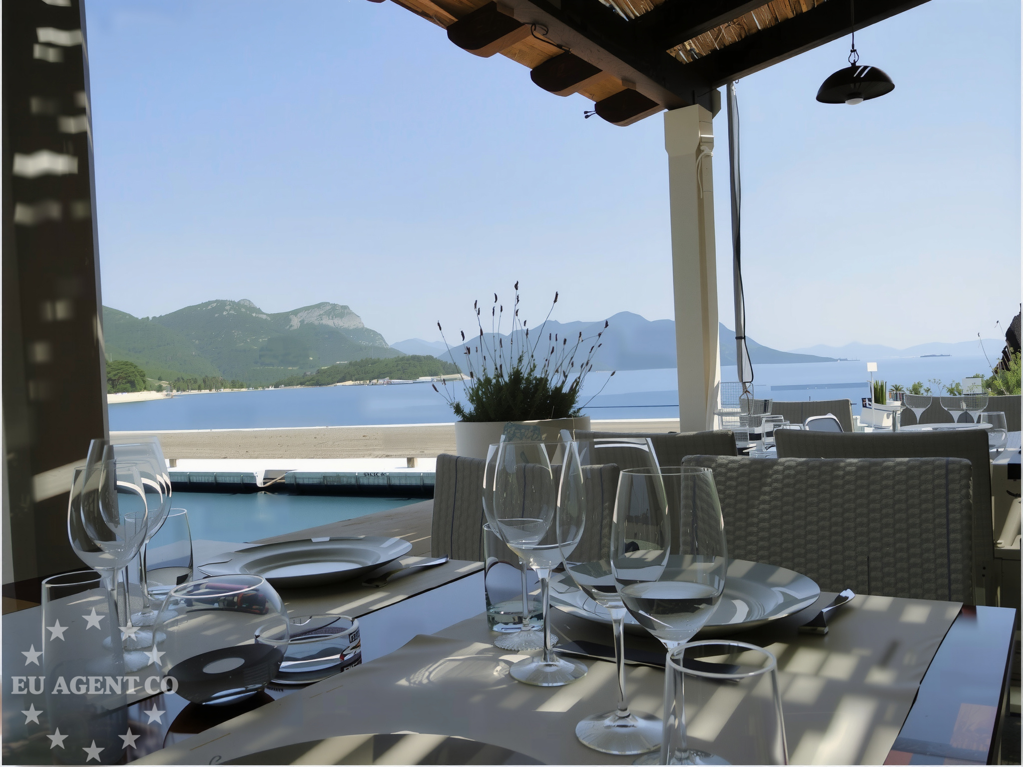 A view of the Trstenik restaurant overlooking the Adriatic Sea with boats in the distance.
